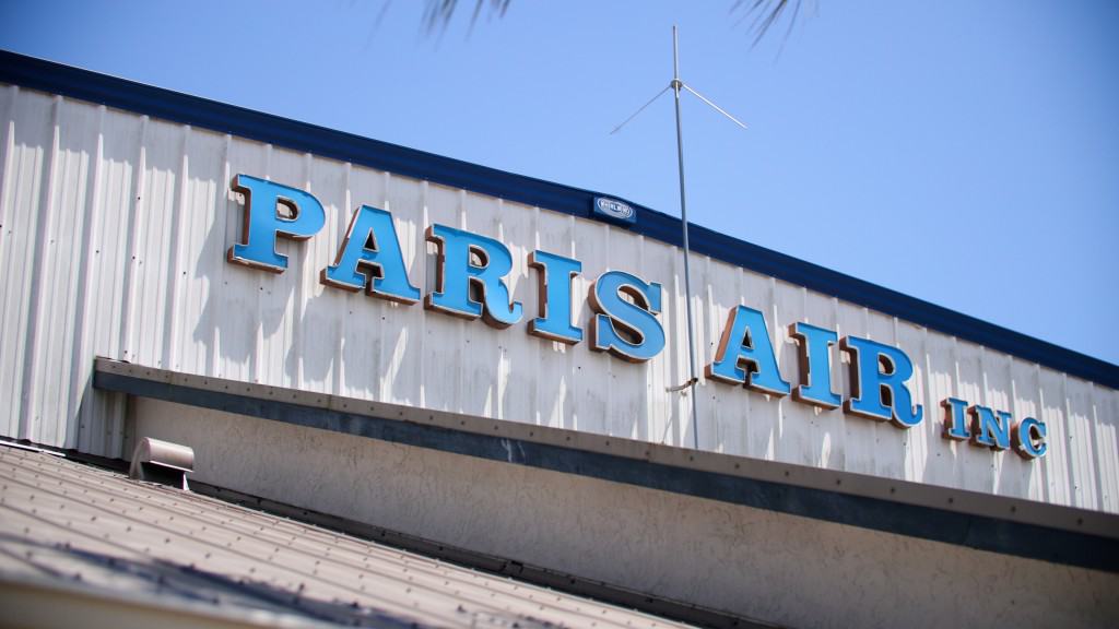 Paris Air Inc sign on the front of the building