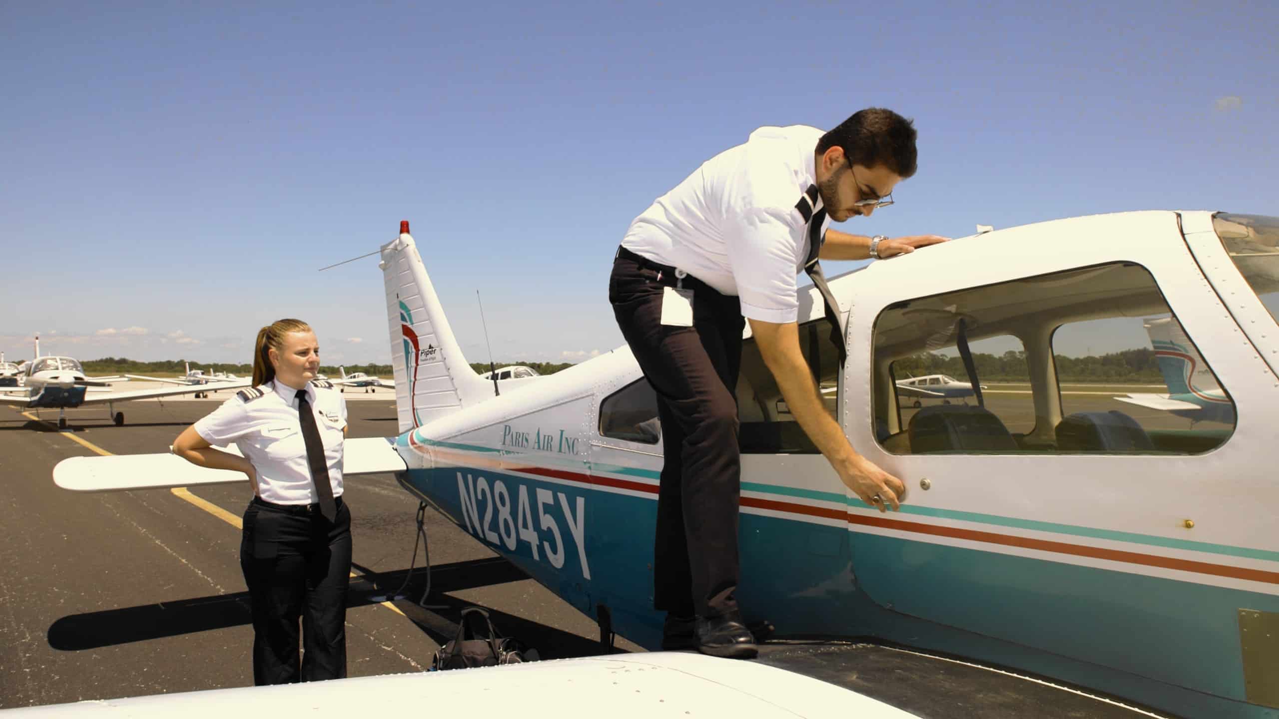 Paris Air students inspect a small airplane