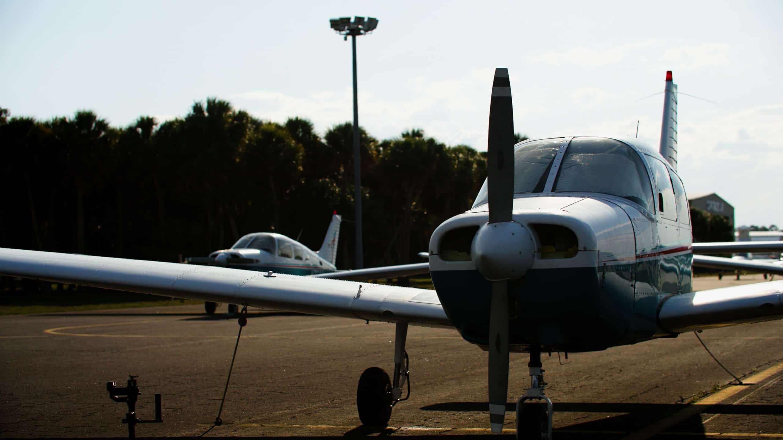 Front view of the propellor of a small airplane parked on the tarmac