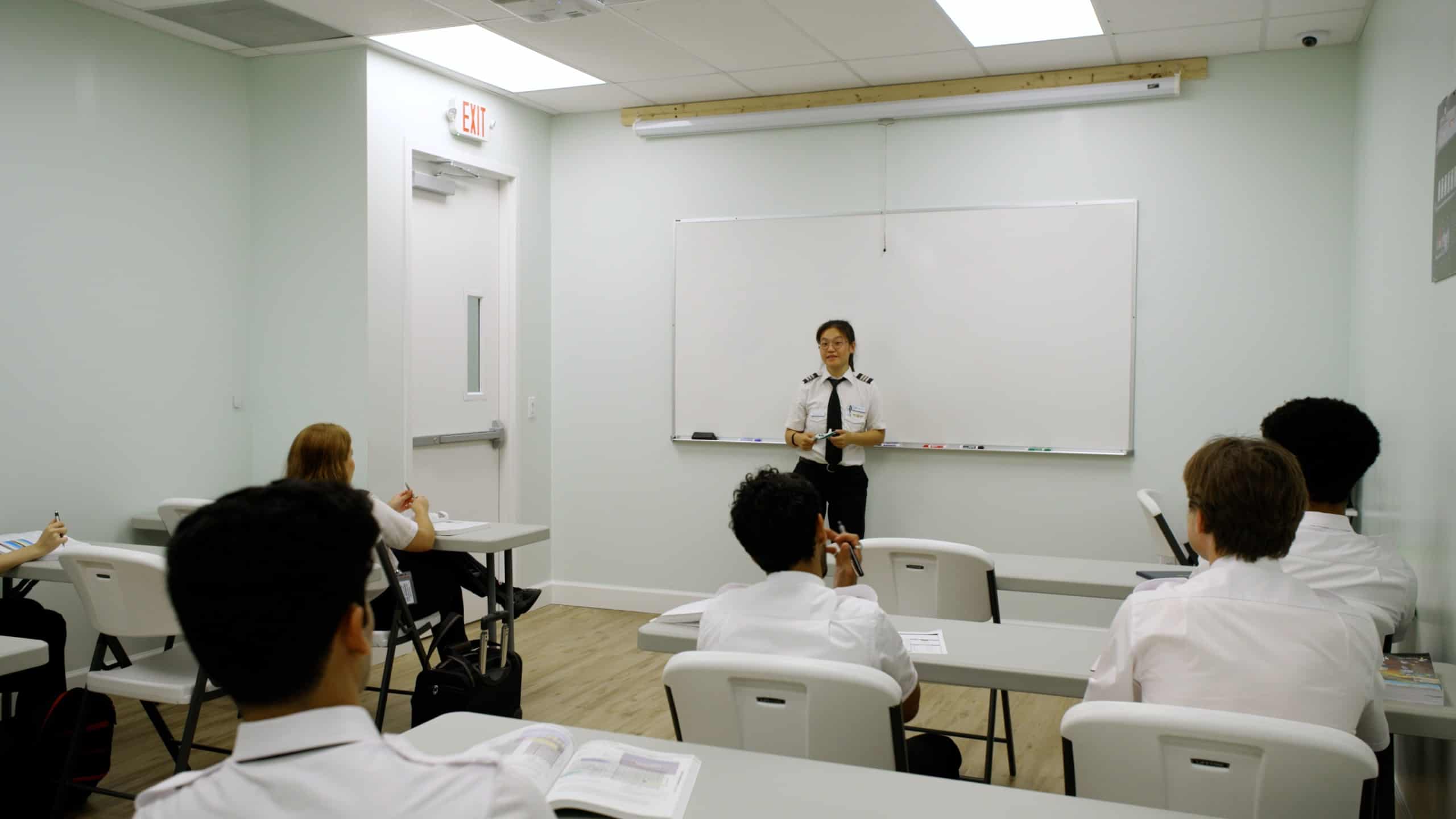A Paris Air instructor in front of a classroom