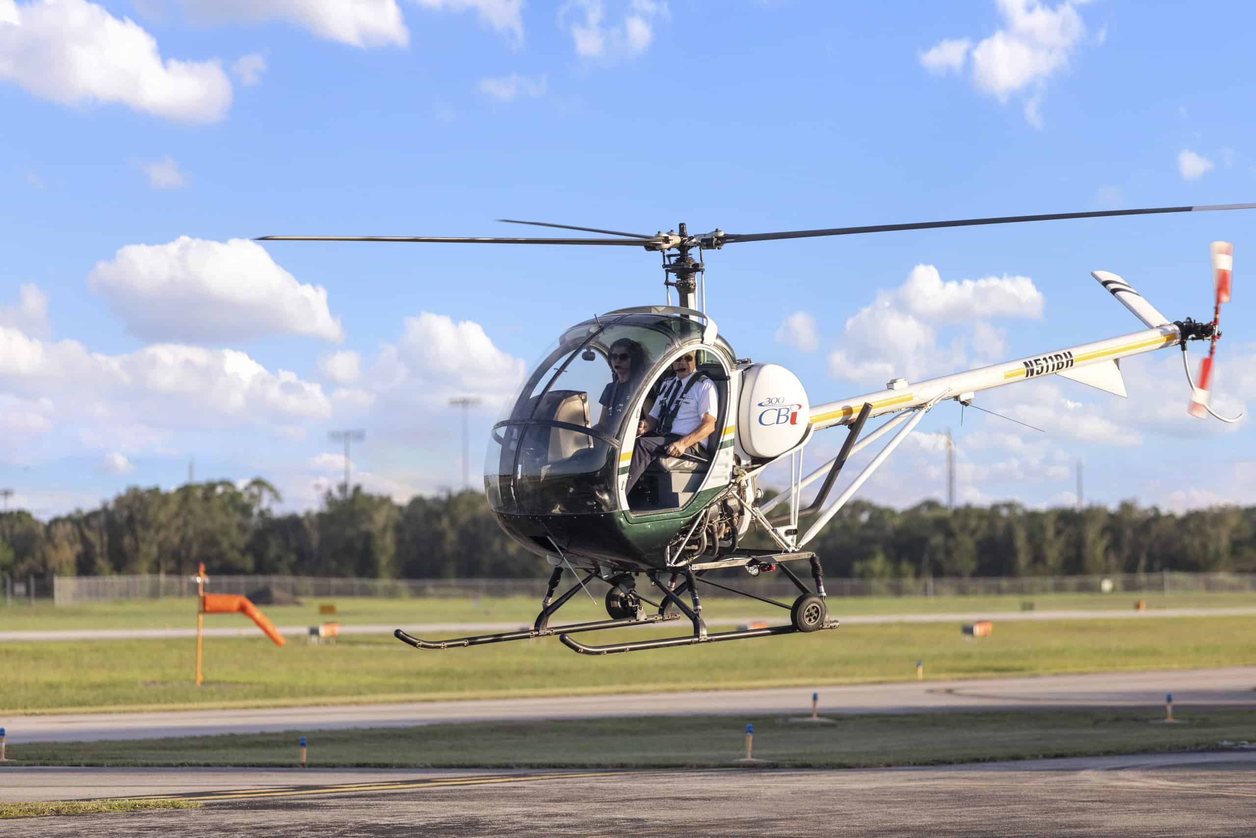 Photo of a helicopter hovering low over the tarmac
