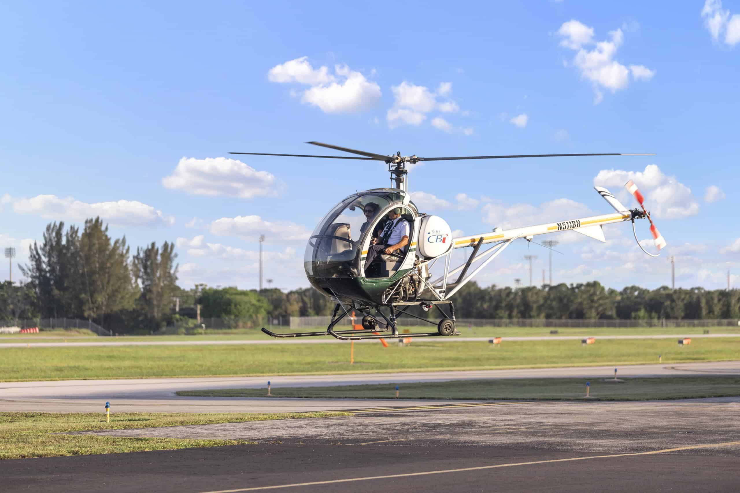 Photo of a helicopter hovering over the tarmac