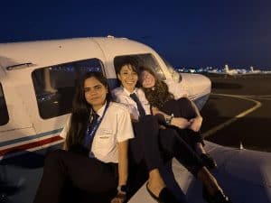women in aviation, female pilot students on plane