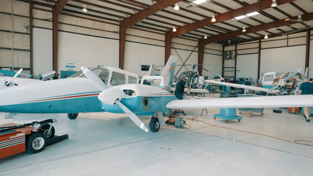 airplane in hangar at paris air flight academy